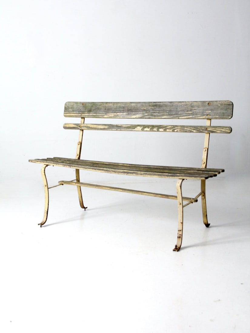 Charming Vintage Garden Bench Pastel Yellow Metal Frame Wood Slats: Charming Vintage Garden Bench Pastel Yellow Metal Frame Wood Slats This vintage garden bench features a charming pastel yellow metal frame paired with a wooden slat seat and backrest, creating a delig