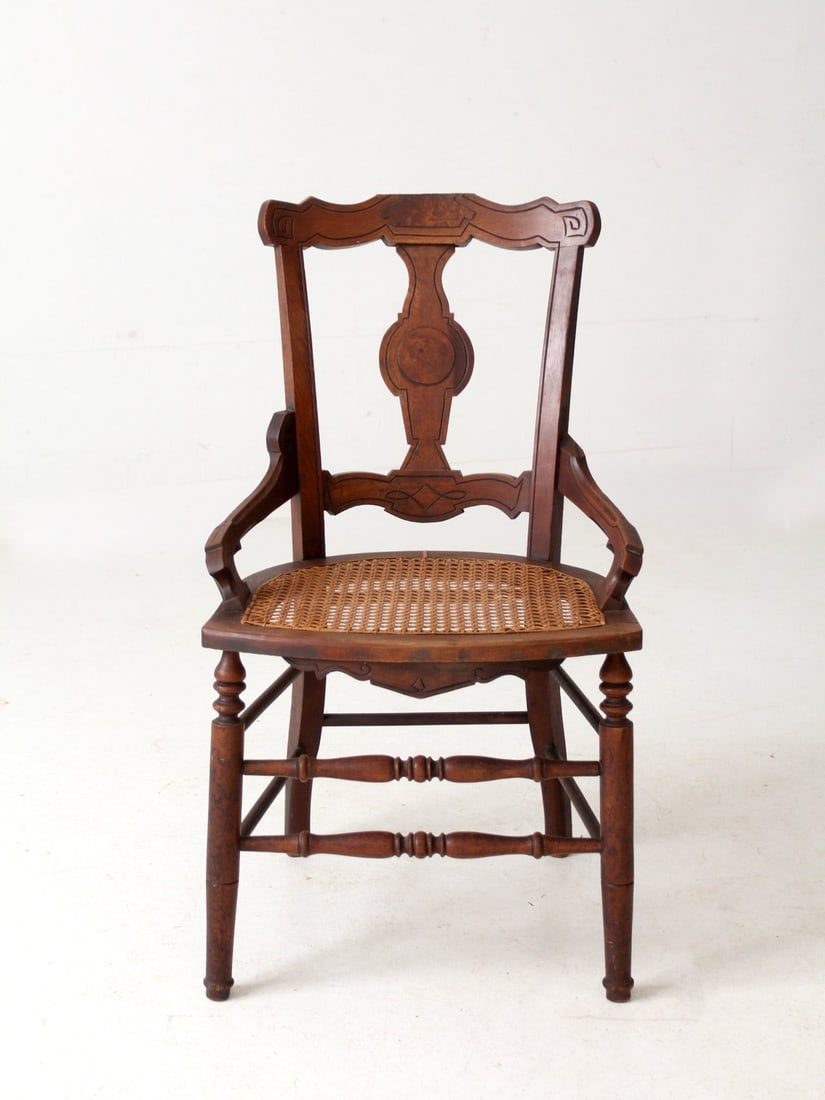 Antique Eastlake Victorian Cane Seat Armchair Classic Design: Antique Eastlake Victorian Cane Seat Armchair Classic Design This antique Eastlake armchair showcases a beautifully shaped splat back and a woven cane seat, reflecting the intricate design aesthetic o