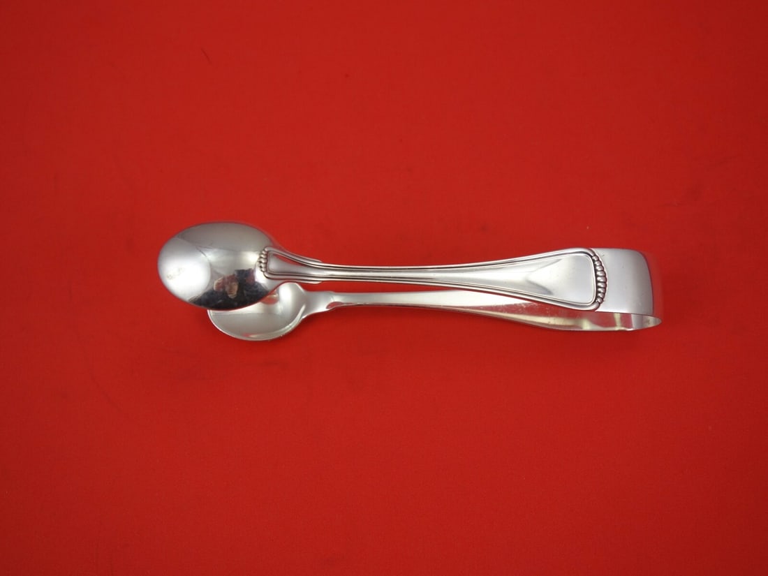 Buccellati Milano Sterling Silver Ice Tong 5.5 Inch Serving Piece: Buccellati Milano Sterling Silver Ice Tong 5.5 Inch Serving Piece Experience elegance with this Milano ice tong by Buccellati, crafted from high-quality sterling silver. Measuring 5 1/2 inches, this e