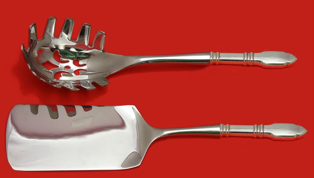 Graff W & D Robert Bruce Sterling Silver Pasta Server Set 2pc: Graff W & D Robert Bruce Sterling Silver Pasta Server Set 2pc Enhance your dining experience with this exquisite 2-piece Italian Pasta Server Set, crafted in sterling silver by Graff W & D. The set in