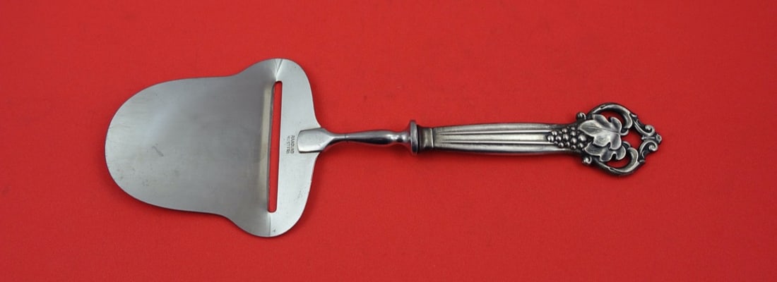 Cohr Sterling Silver Cheese Plane Grapes Design 8.5 Inches: Cohr Sterling Silver Cheese Plane Grapes Design 8.5 Inches Presenting a stunning sterling silver cheese plane from Cohr, featuring a hollow handle with a durable stainless steel implement. The design