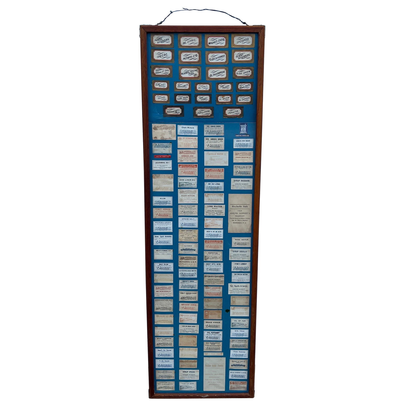 Rare 1950s Adolph Schmidt Pharmacy Display with 110 Antique Labels: Rare 1950s Adolph Schmidt Pharmacy Display with 110 Antique Labels This exquisite antique pharmacy label display features 110 unique labels from the renowned Adolph Schmidt's pharmacy, which operated