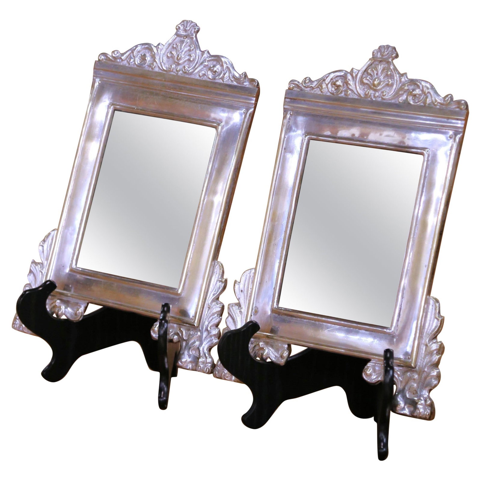 Antique Pair of 19th Century French Silver Plated Repousse Mirrors Set of 2: Antique Pair of 19th Century French Silver Plated Repousse Mirrors Set of 2 Enhance your interior decor with this exquisite pair of 19th Century French silver plated repousse mirrors. Crafted in Franc