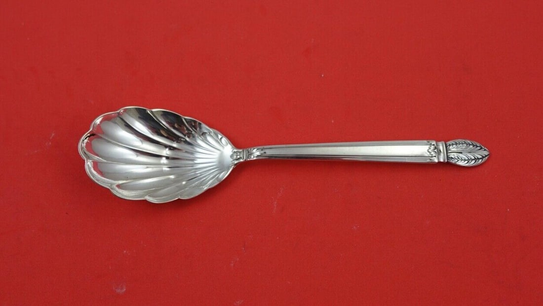 Reed and Barton Colonial Classic Sterling Silver Sugar Spoon 6 1/4": Reed and Barton Colonial Classic Sterling Silver Sugar Spoon 6 1/4" This exquisite sugar spoon is crafted in sterling silver and features the elegant Colonial Classic pattern by Reed and Barton. With