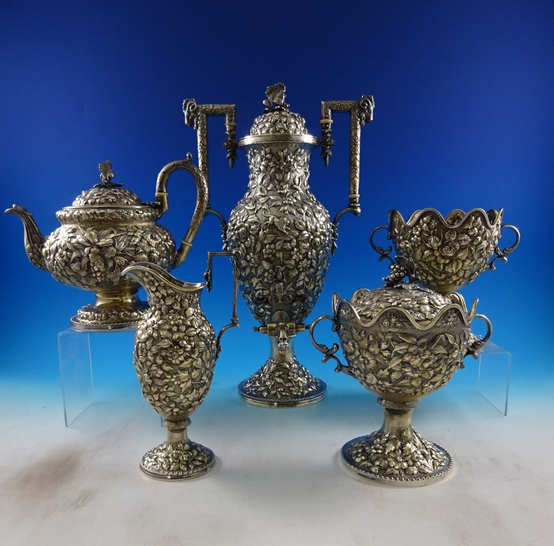 A.E. Warner Repousse Coin Silver 5-Piece Tea Set with Animal Motifs: A.E. Warner Repousse Coin Silver 5-Piece Tea Set with Animal Motifs This exquisite 5-piece tea set by A.E. Warner showcases the remarkable repousse craftsmanship of renowned Baltimore silversmith A.E.