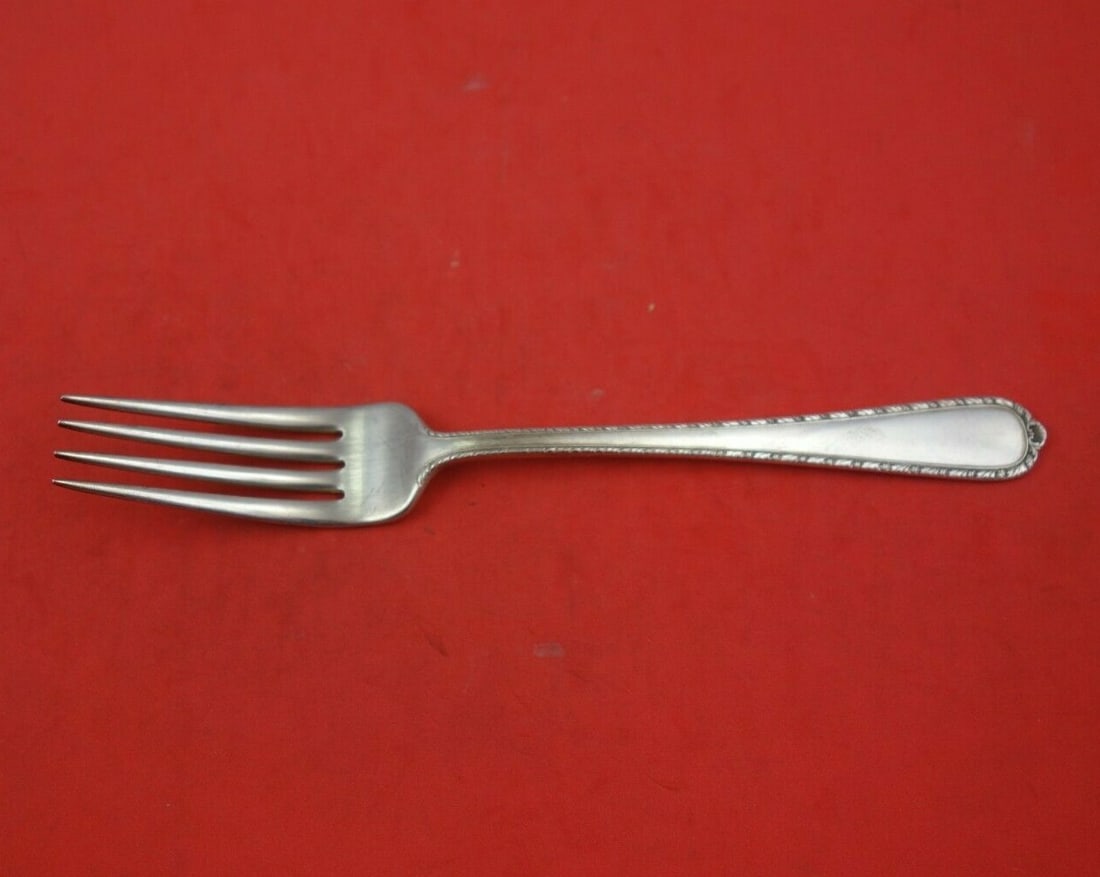 Vintage International Sterling Silver Pine Tree Fork 7 1/4": Vintage International Sterling Silver Pine Tree Fork 7 1/4" This vintage Pine Tree regular fork by International is a stunning piece of flatware, crafted from high-quality sterling silver. Measuring 7
