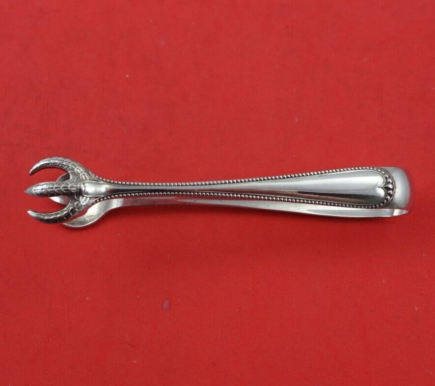 Gorham Newcastle Sterling Silver Sugar Tong 5 Inch Serving Piece: Gorham Newcastle Sterling Silver Sugar Tong 5 Inch Serving Piece Elevate your dining experience with the Newcastle by Gorham Sterling Silver Sugar Tong, measuring 5 inches. Crafted from high-quality s