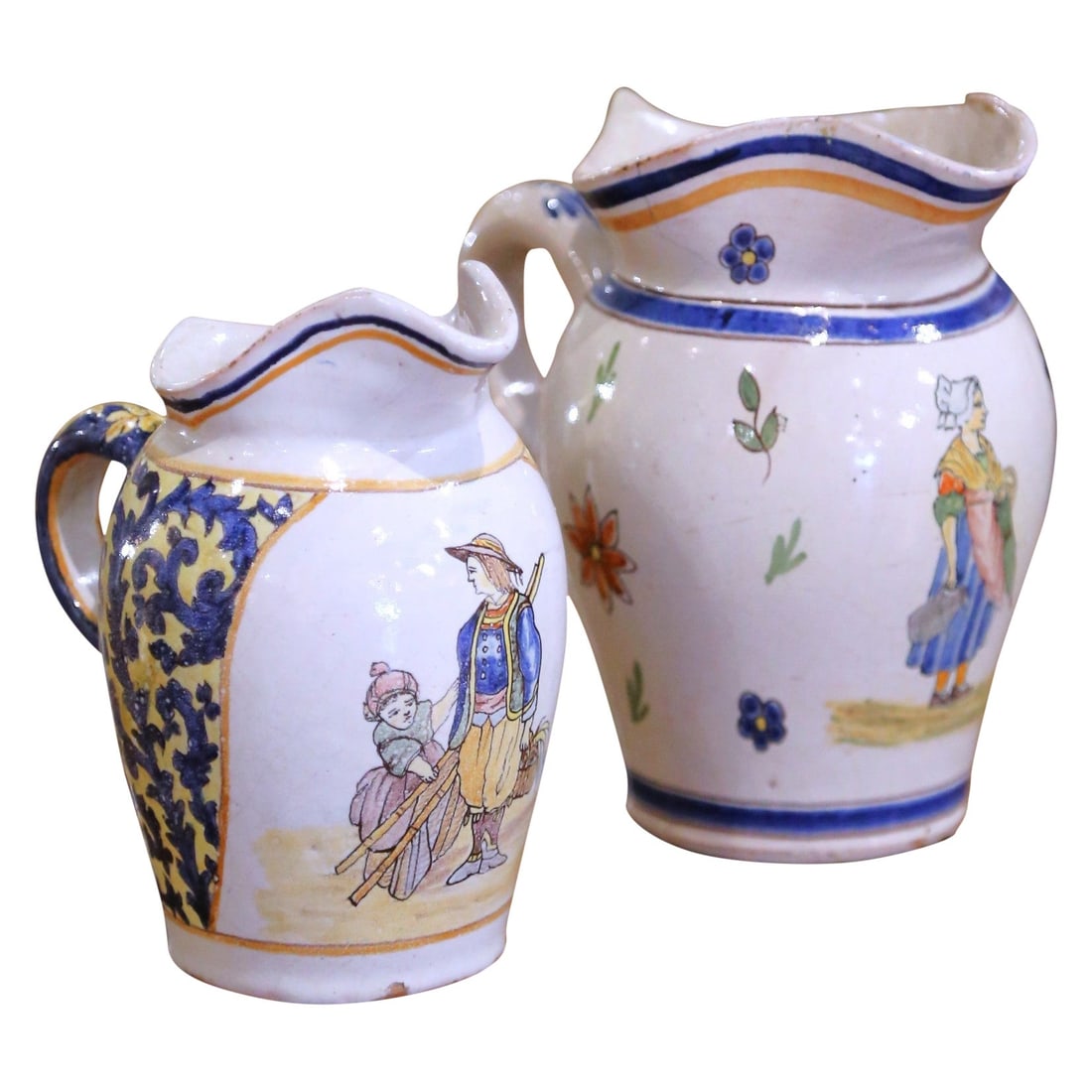 Set of Two Antique French Quimper Faience Jugs With Breton Folk Designs: Set of Two Antique French Quimper Faience Jugs With Breton Folk Designs This pair of late 19th-century Quimper faience jugs from Brittany, France, features hand-thrown and hand-painted craftsmanship,