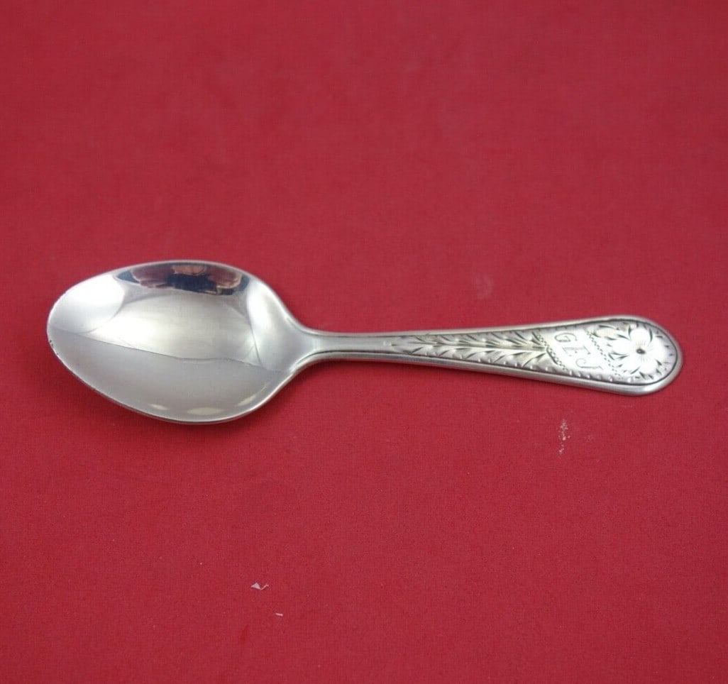 Engraved Sterling Silver Baby Spoon Pat Jane 4 3/8 Baby Silver Pattern: Engraved Sterling Silver Baby Spoon Pat Jane 4 3/8 Baby Silver Pattern This exquisite sterling silver baby spoon features the 'Pat Jane' pattern, adorned with delicate engraved flowers. Measuring 4 3/