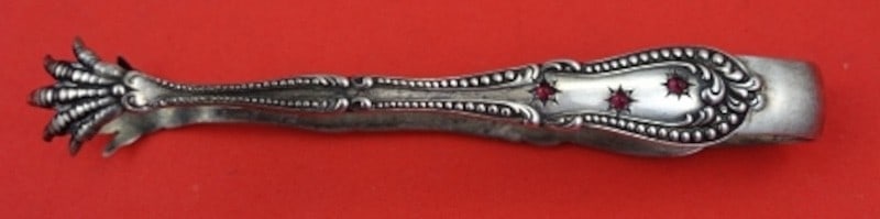 Sterling Silver Sugar Tong with Six Cabochon Garnets Colonial Pattern 3 7/8 Inch: Sterling Silver Sugar Tong with Six Cabochon Garnets Colonial Pattern 3 7/8 Inch This sterling silver sugar tong features the Colonial pattern and is adorned with six cabochon garnets. Crafted by vari