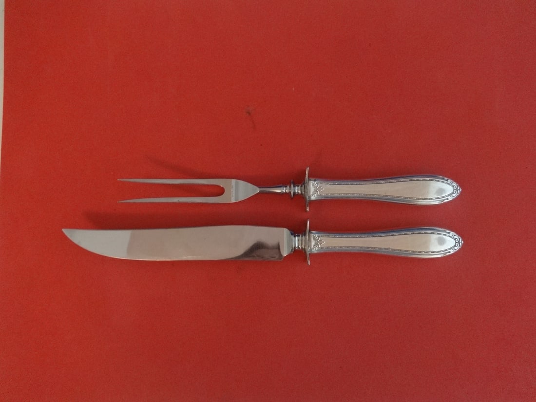 International Sterling Silver Lady Betty 2pc Steak Carving Set: International Sterling Silver Lady Betty 2pc Steak Carving Set This exquisite Lady Betty steak carving set features a stunning design by International Sterling. Comprising two pieces, it includes a kn