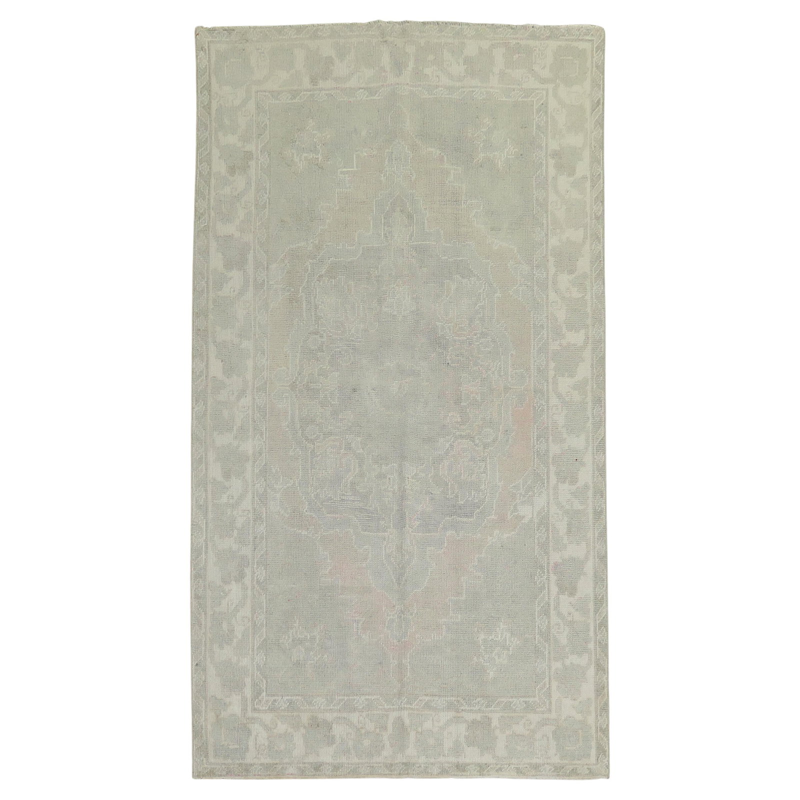 Vintage Turkish Oushak Rug Soft Colors Hand-Knotted Wool 58x96: Vintage Turkish Oushak Rug Soft Colors Hand-Knotted Wool 58x96 This exquisite mid-20th century Turkish Oushak rug features soft, subtle colors that enhance any industrial-style space. Hand-knotted fro