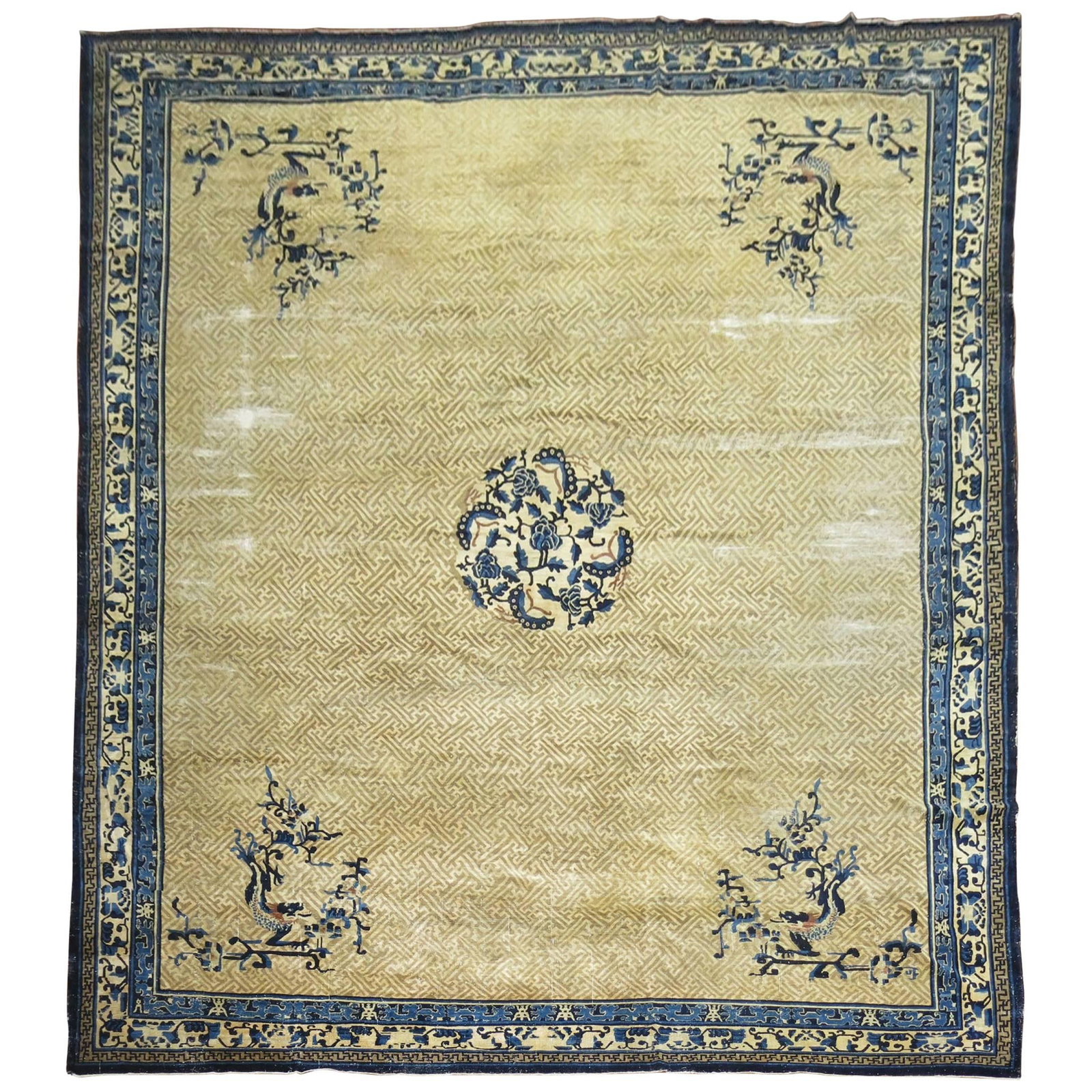 Oversized Late 19th Century Chinese Wool Peking Rug in Tan and Blue: Oversized Late 19th Century Chinese Wool Peking Rug in Tan and Blue This oversize Chinese Peking rug, dating to the late 19th century, features an archaistic style with simple and asymmetrical designs