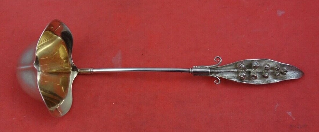 Wood & Hughes Sterling Silver Sauce Ladle Lily of the Valley 7 3/4 Gold Wash: Wood & Hughes Sterling Silver Sauce Ladle Lily of the Valley 7 3/4 Gold Wash This exquisite sauce ladle by Wood & Hughes features the elegant "Lily of the Valley" pattern. Made from high-quality sterl