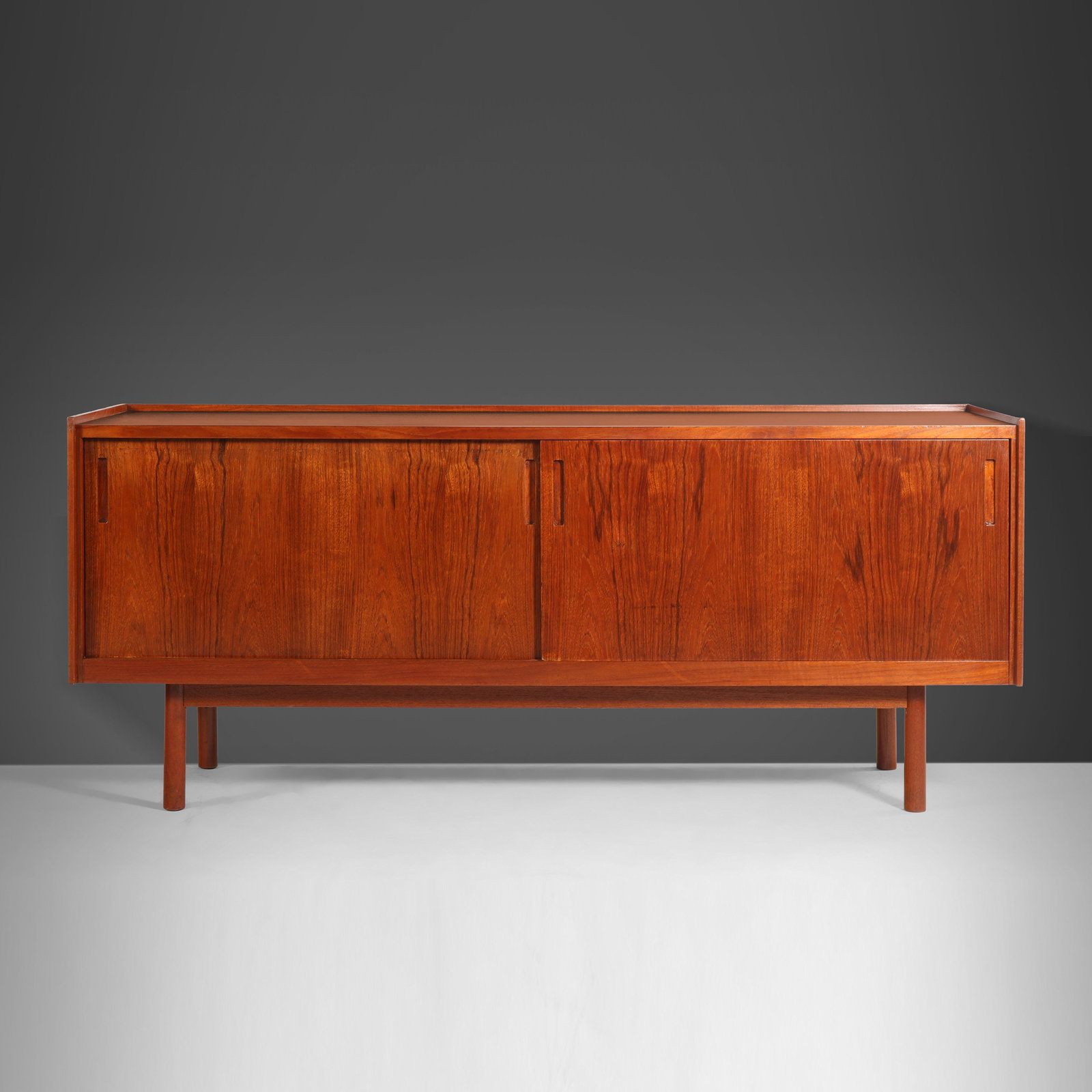 Danish Modern Teak Credenza by J. Clausen for Brande Mobelfabrik 1960s: Danish Modern Teak Credenza by J. Clausen for Brande Mobelfabrik 1960s This Petite Danish Modern Credenza is a stunning piece crafted from high-quality teak, designed by J. Clausen for Brande Mobelfab