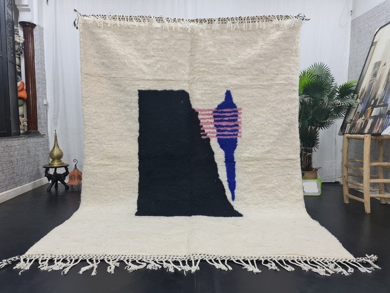Handwoven Moroccan Berber Wool Rug Black Blue Design 9.84 x 6.56 Feet: Handwoven Moroccan Berber Wool Rug Black Blue Design 9.84 x 6.56 Feet Experience the elegance of this stunning handwoven Moroccan Berber wool area rug. Featuring a beautifully designed pattern in blac