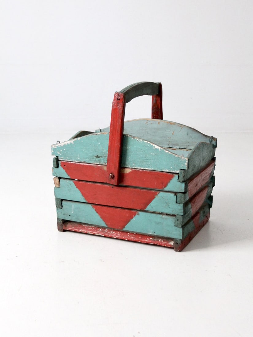 Vintage Teal Painted Wooden Basket With Folk Art Geometric Designs: Vintage Teal Painted Wooden Basket With Folk Art Geometric Designs This vintage wooden crate basket features a soft teal finish accented by hand-painted red geometric designs, reflecting the charm of