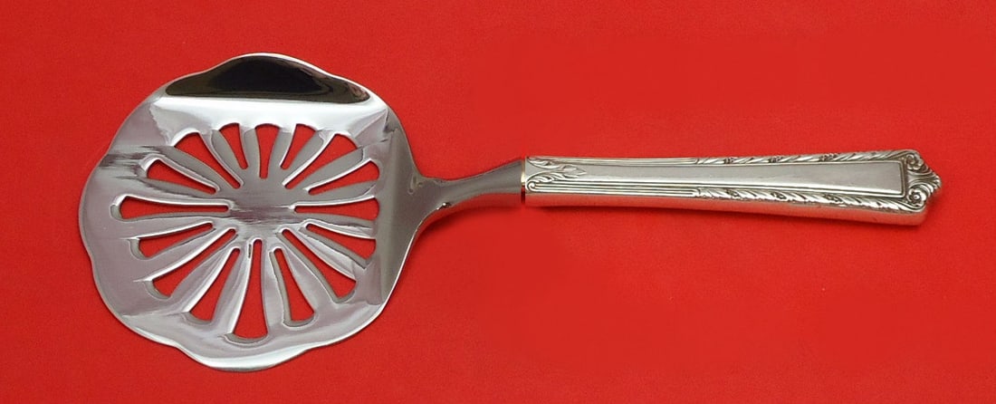 International Sterling Silver Processional Tomato Server Custom Made 8.5": International Sterling Silver Processional Tomato Server Custom Made 8.5" This exquisite tomato server is crafted from high-quality sterling silver, featuring a hollow handle and a durable stainless i