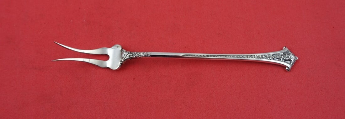 Gorham Classic Bouquet Sterling Silver 2-Tine Pickle Fork 5 3/4": Gorham Classic Bouquet Sterling Silver 2-Tine Pickle Fork 5 3/4" Indulge in the elegance of the Classic Bouquet Pickle Fork by Gorham. This exquisite serving fork features a delicate 2-tine design and