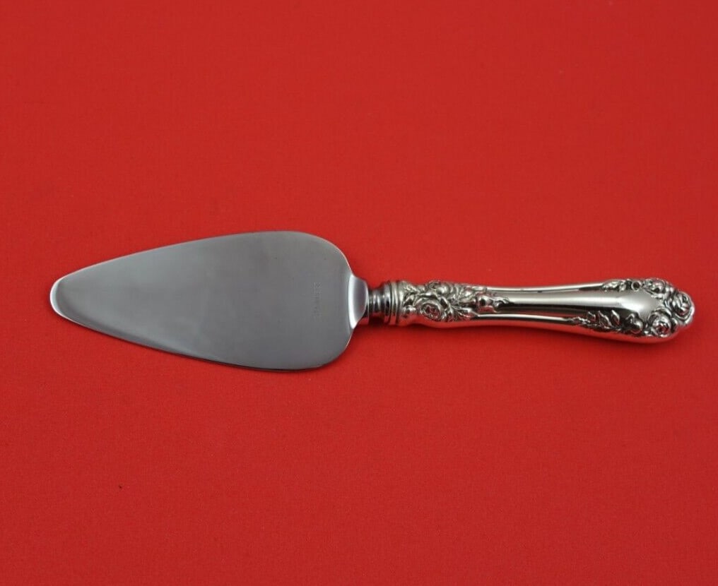 Wallace Rose Sterling Silver Cheese Server 6 3/8 Inches: Wallace Rose Sterling Silver Cheese Server 6 3/8 Inches This exquisite cheese server features the elegant Rose pattern by Wallace, crafted from sterling silver with a stainless steel blade. Measuring