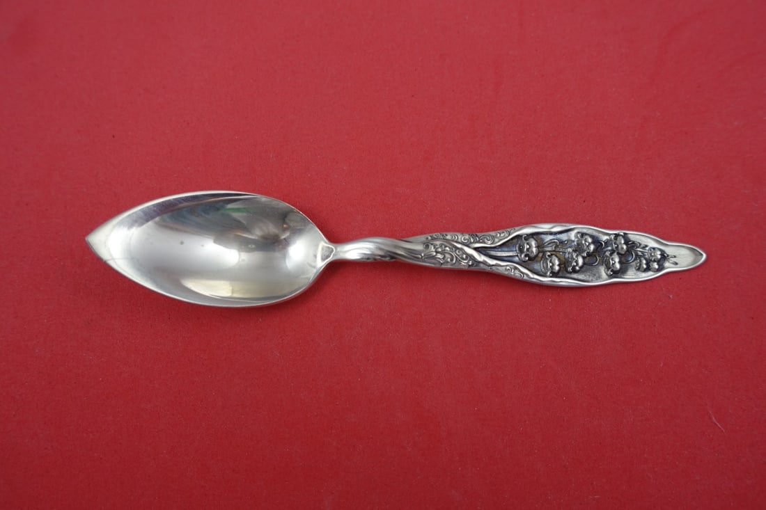 Whiting Lily of the Valley Sterling Silver Grapefruit Spoon 5 1/4": Whiting Lily of the Valley Sterling Silver Grapefruit Spoon 5 1/4" This exquisite grapefruit spoon features the elegant "Lily of the Valley" pattern by Whiting, crafted from high-quality sterling