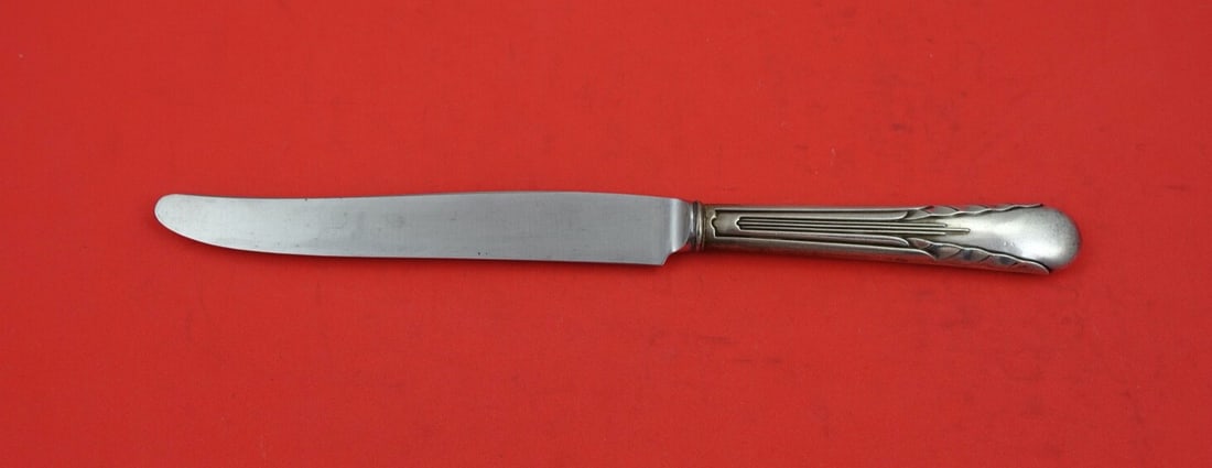 International Sterling Silver Orchid Dinner Knife French 9.5 inch: International Sterling Silver Orchid Dinner Knife French 9.5 inch This exquisite dinner knife features the elegant "Orchid" pattern by International Sterling. Crafted with a sterling silver hollow han