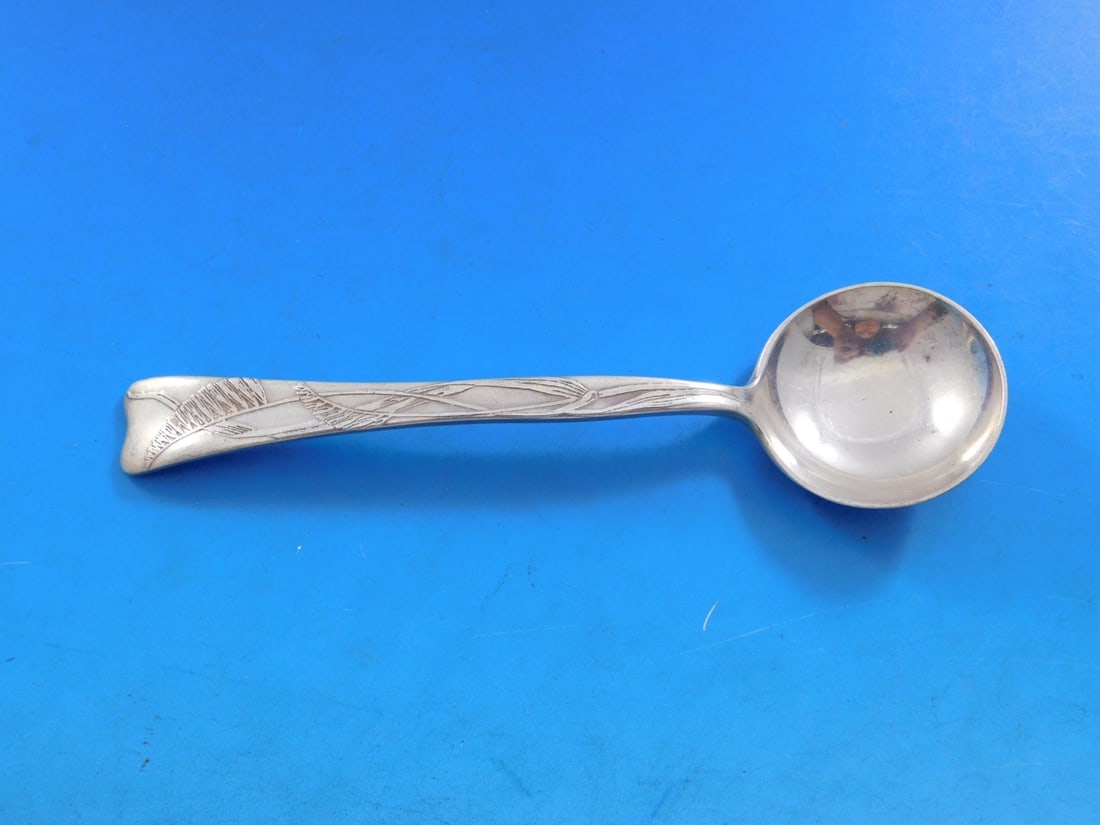 Bouillon Soup Spoon Lap Over Edge Acid Etched Sterling Buffalo Grass Motif: Bouillon Soup Spoon Lap Over Edge Acid Etched Sterling Buffalo Grass Motif This is a Tiffany & Co. Lap Over Edge acid etched bouillon soup spoon crafted from sterling silver. Featuring the intricate B