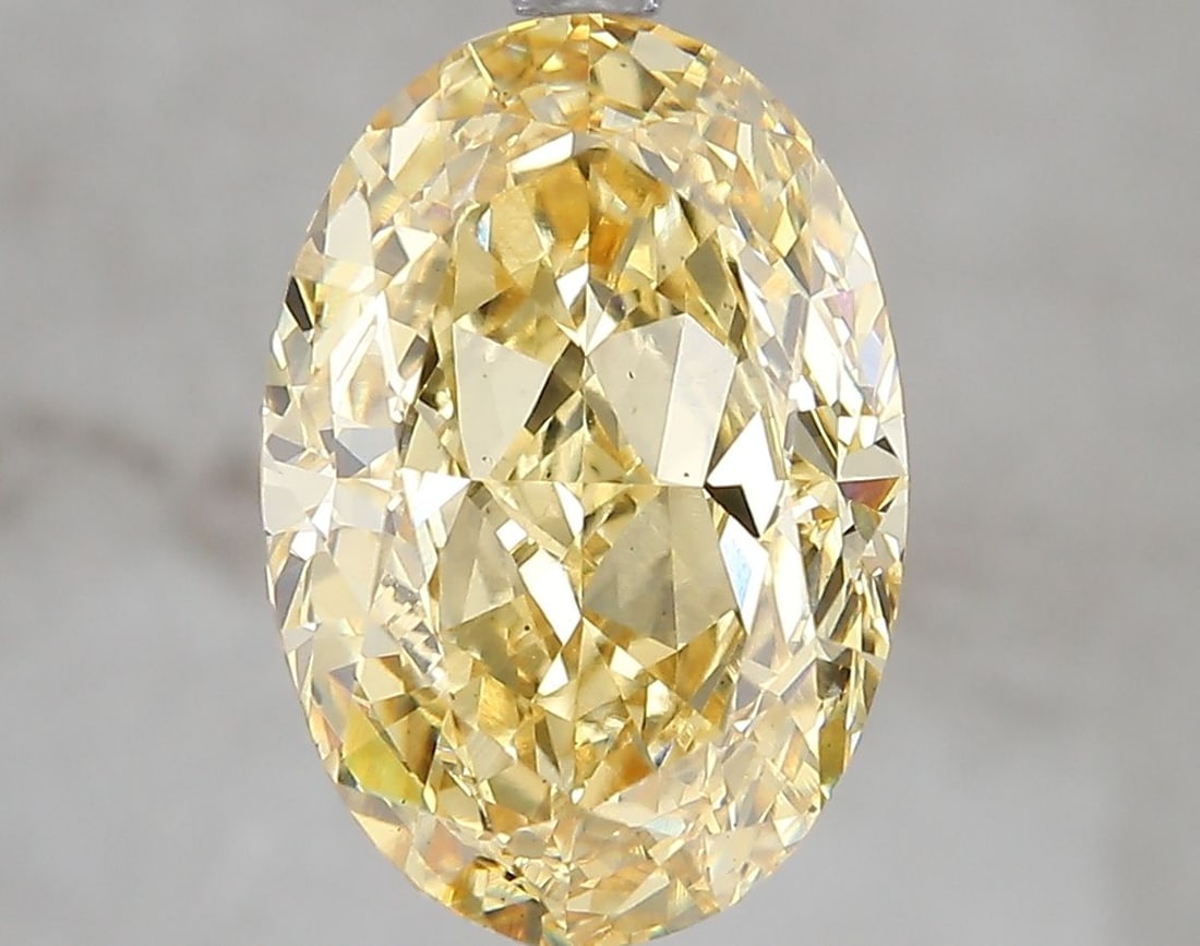 Loose Diamond - OVAL 5.07ct Fancy Vivid Yellow VS2: Loose Diamond - OVAL 5.07ct Fancy Vivid Yellow VS2 Source: This is a real non-mined Diamond that has been grown in a lab Shape: OVAL Carats: 5.07 Color: Fancy Vivid Yellow Certification: IGI Video: