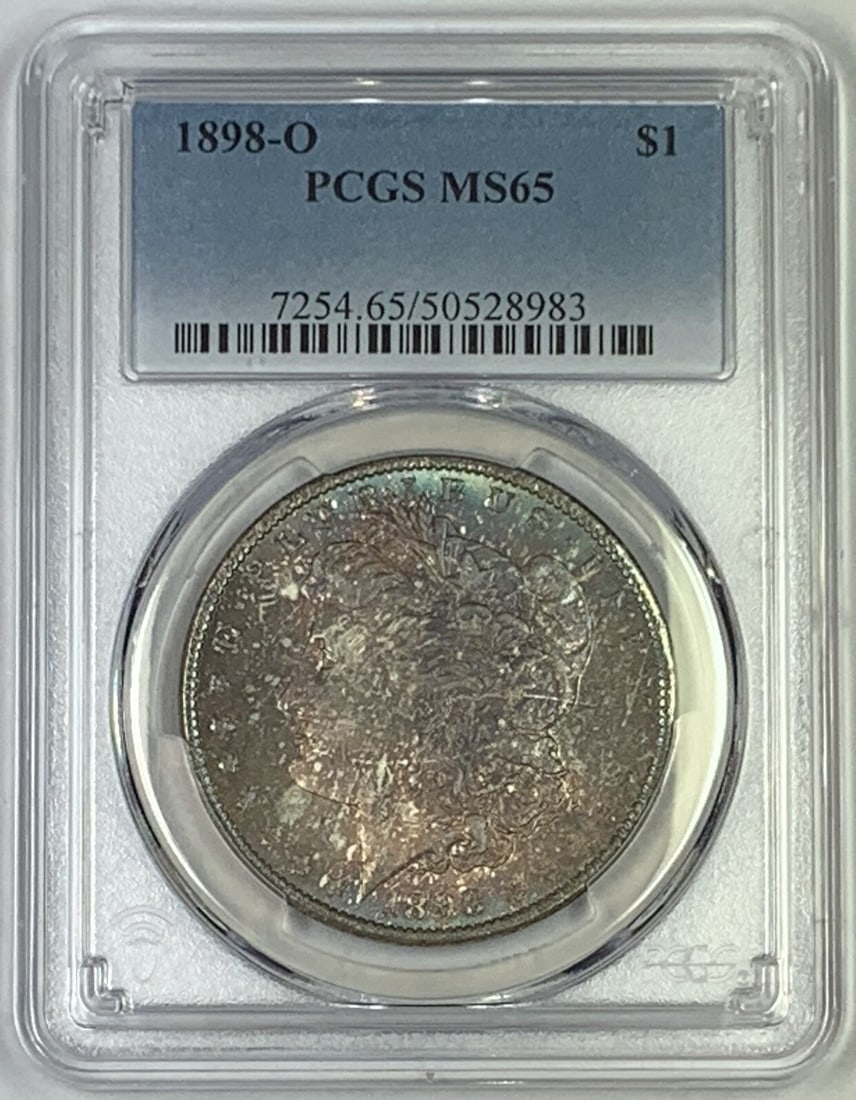 PCGS MS 65 1898-O Morgan Silver Dollar with Toned Finish: PCGS MS 65 1898-O Morgan Silver Dollar with Toned Finish This 1898-O Morgan Silver Dollar features attractive toning and has been certified by PCGS with a grade of MS 65. Minted in the United States a