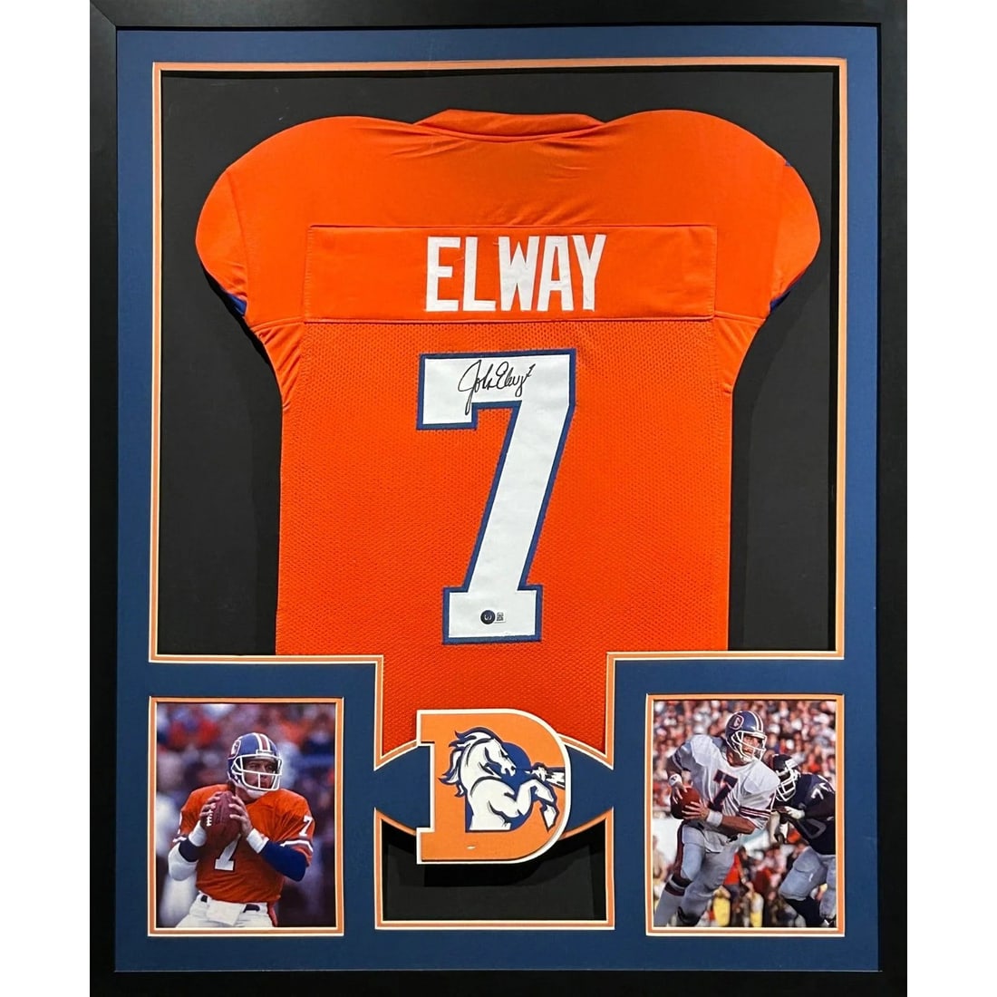 John Elway Autographed Framed Jersey Denver Broncos Beckett Certified: John Elway Autographed Framed Jersey Denver Broncos Beckett Certified This is a stunning autographed John Elway framed jersey, showcasing a vibrant orange color associated with the Denver Broncos. Aut