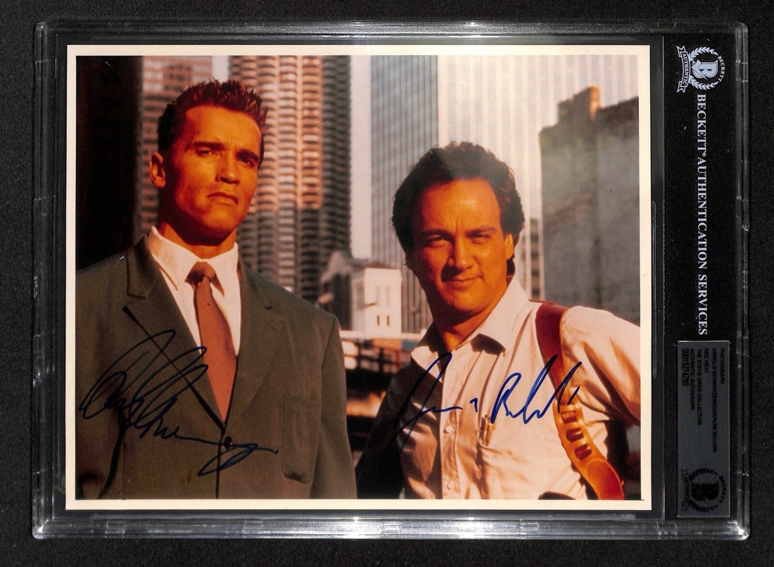 Arnold Schwarzenegger Jim Belushi Signed 8x10 Red Heat Photograph Beckett Authenticated: Arnold Schwarzenegger Jim Belushi Signed 8x10 Red Heat Photograph Beckett Authenticated This autographed 8x10 color photograph features iconic actors Arnold Schwarzenegger and Jim Belushi from the fil