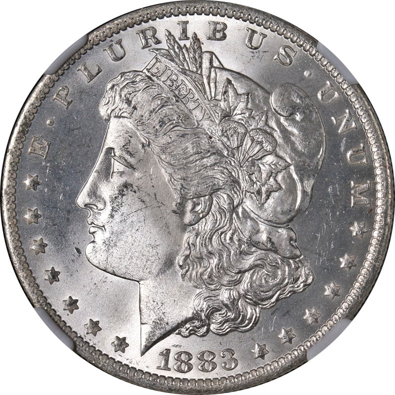 NGC MS65 1883-O Uncirculated Morgan Silver Dollar Blast White: NGC MS65 1883-O Uncirculated Morgan Silver Dollar Blast White This original 1883-O Morgan Silver Dollar is certified by NGC with a grade of MS65. The coin features a blast white appearance, strong str