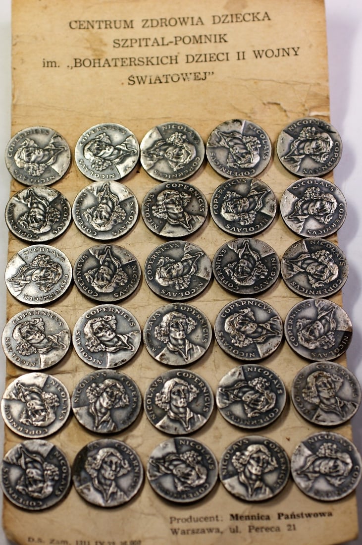 Page of 30 Uncirculated Bronze Nicolas Copernicus Medals Honoring Polish Scientist: Page of 30 Uncirculated Bronze Nicolas Copernicus Medals Honoring Polish Scientist This is a page featuring 30 uncirculated medals commemorating Nicolas Copernicus, the renowned Polish scientist. The