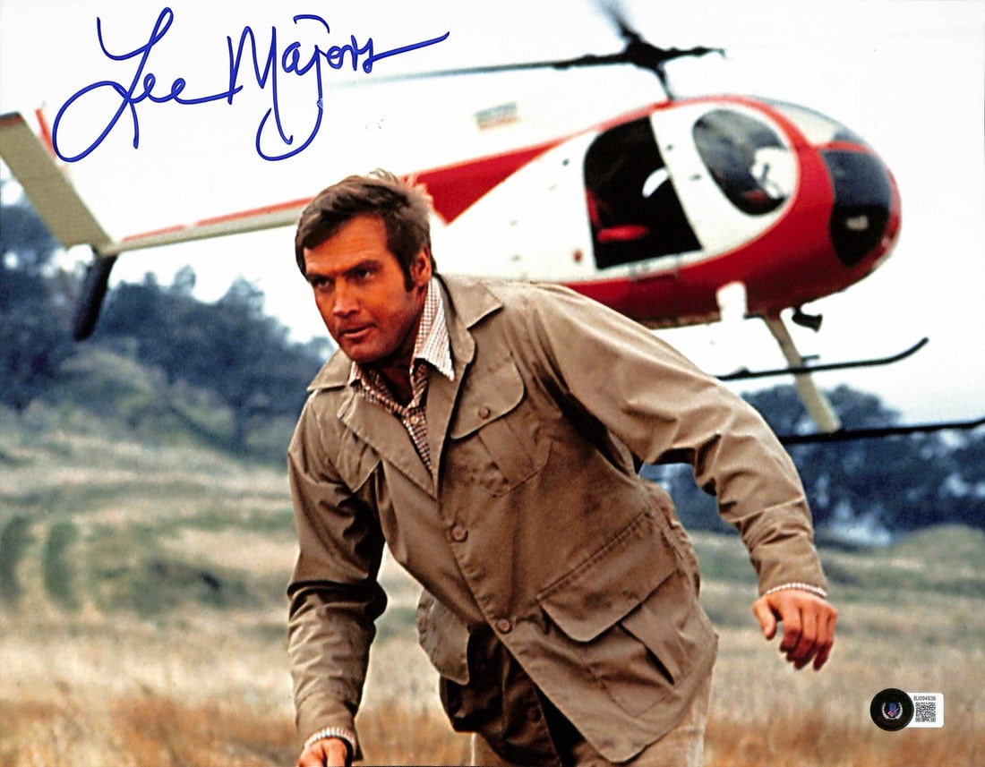 Lee Majors Signed 11x14 Six Million Dollar Man Photo Beckett Certified: Lee Majors Signed 11x14 Six Million Dollar Man Photo Beckett Certified This impressive 11x14 photograph features Lee Majors, renowned for his role as 'Steve Austin' in the iconic TV series, 'Six Milli