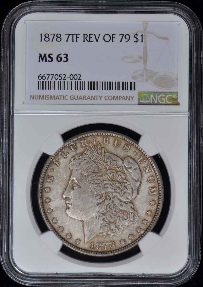 1878 Morgan Dollar S$1 NGC MS63 Uncirculated Philadelphia Mint: 1878 Morgan Dollar S$1 NGC MS63 Uncirculated Philadelphia Mint This 1878 Morgan Dollar is a stunning example of American numismatic history. Certified by NGC with a grade of MS63, this uncirculated co
