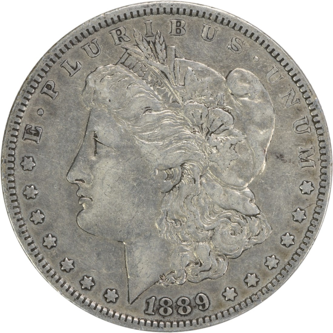 1889-O Morgan Silver Dollar Uncertified 90% Silver Coin: 1889-O Morgan Silver Dollar Uncertified 90% Silver Coin This 1889-O Morgan Silver Dollar is a captivating piece of numismatic history, featuring a beautiful design by George T. Morgan. With a composit