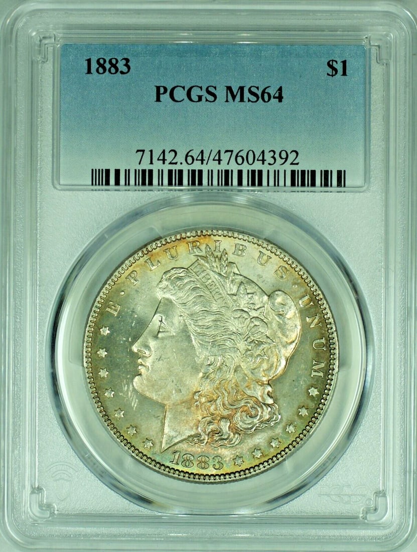PCGS MS 64 1883 Morgan Dollar Silver Toned United States Coin: PCGS MS 64 1883 Morgan Dollar Silver Toned United States Coin This is an 1883 Morgan Silver Dollar from the United States, featuring a toned finish. The coin is certified by PCGS with a grade of MS 64