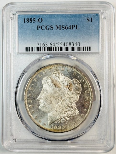 PCGS MS64 PL 1885 O Rainbow Toned Morgan Silver Dollar: PCGS MS64 PL 1885 O Rainbow Toned Morgan Silver Dollar This 1885 O Morgan Silver Dollar is certified by PCGS with a grade of MS-64 PL, indicating a proof-like finish and uncirculated condition. The co