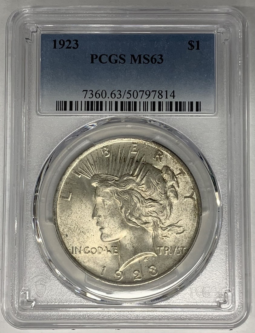 1923 Peace Dollar Silver Coin PCGS MS 63 Certified Uncirculated: 1923 Peace Dollar Silver Coin PCGS MS 63 Certified Uncirculated This is a 1923 Peace Silver Dollar coin from the United States, certified by PCGS with a grade of MS 63. The coin is uncirculated and co