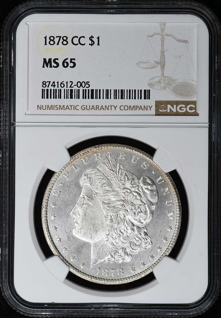 NGC MS65 Carson City 1878 Morgan Silver Dollar Uncirculated: NGC MS65 Carson City 1878 Morgan Silver Dollar Uncirculated This 1878-CC Morgan Dollar is graded MS65 by NGC, indicating a high-quality, uncirculated coin. Minted in Carson City, this pre-owned silver