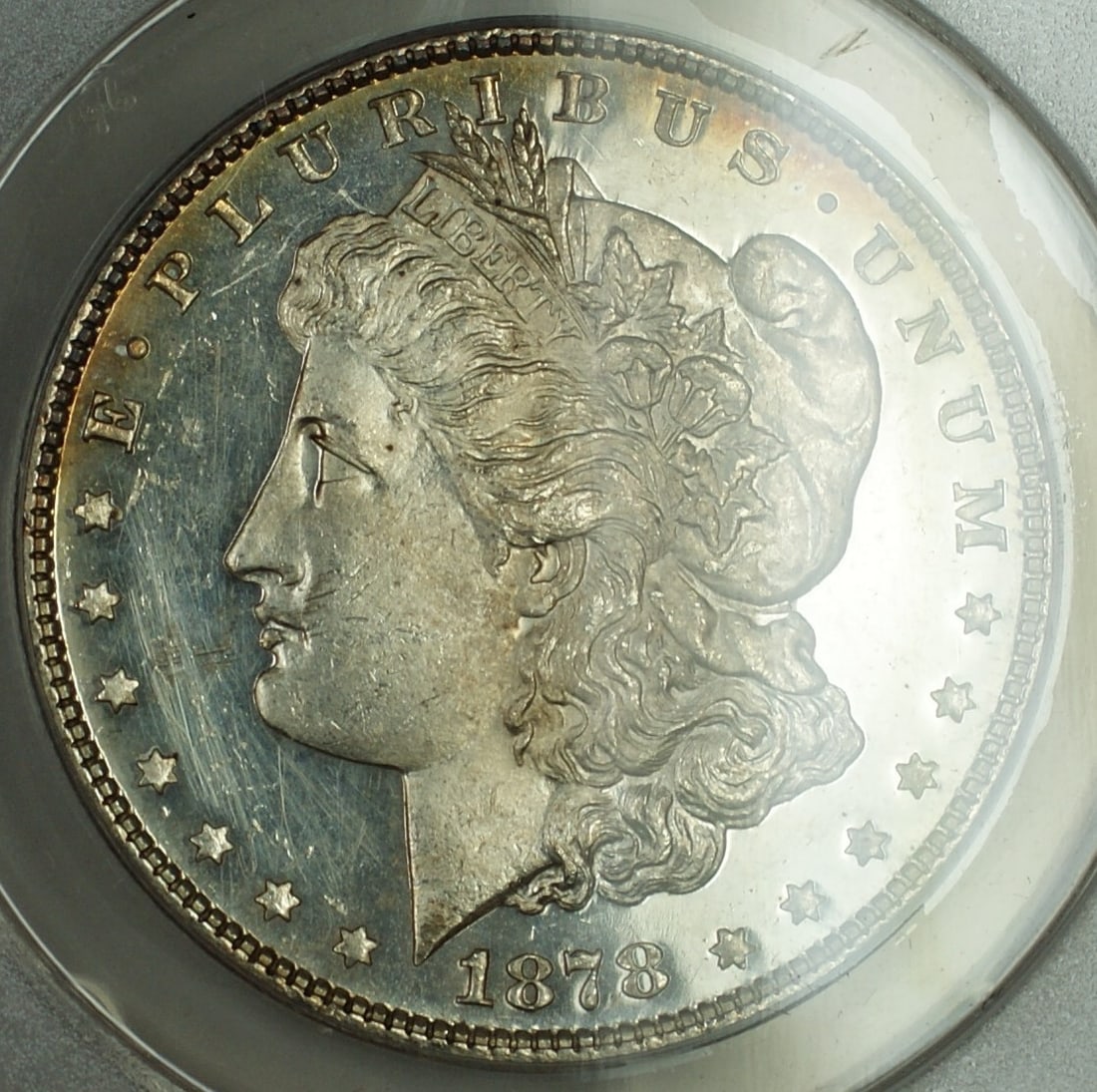 ANACS MS 60 1878 7 Tail Feathers Morgan Silver Dollar Cleaned DMPL Hairlines: ANACS MS 60 1878 7 Tail Feathers Morgan Silver Dollar Cleaned DMPL Hairlines This 1878 7TF Morgan Silver Dollar has been certified by ANACS with a grade of MS 60 Details. The coin originates from the