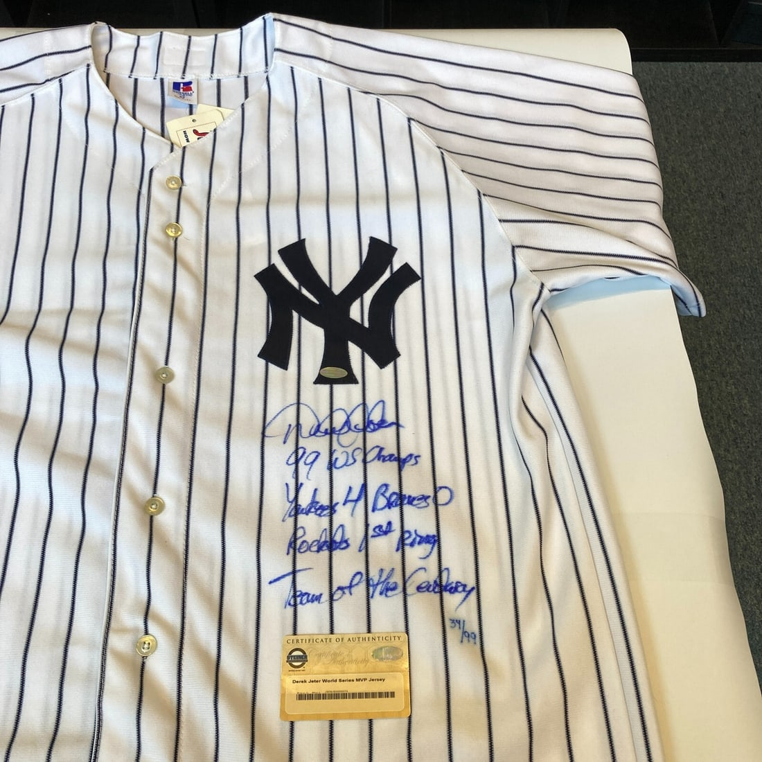 Derek Jeter Signed Yankees World Series Jersey Steiner COA with Inscriptions: Derek Jeter Signed Yankees World Series Jersey Steiner COA with Inscriptions This is an original Derek Jeter signed New York Yankees jersey featuring multiple inscriptions related to the 1999 World Se
