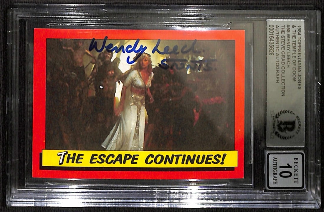 Wendy Leach Signed 1984 Topps Indiana Jones #2 Autograph Grade 10 Beckett: Wendy Leach Signed 1984 Topps Indiana Jones #2 Autograph Grade 10 Beckett This 1984 Topps Indiana Jones #2 trading card features the autograph of stuntwoman Wendy Leach, known for her work in "Indiana