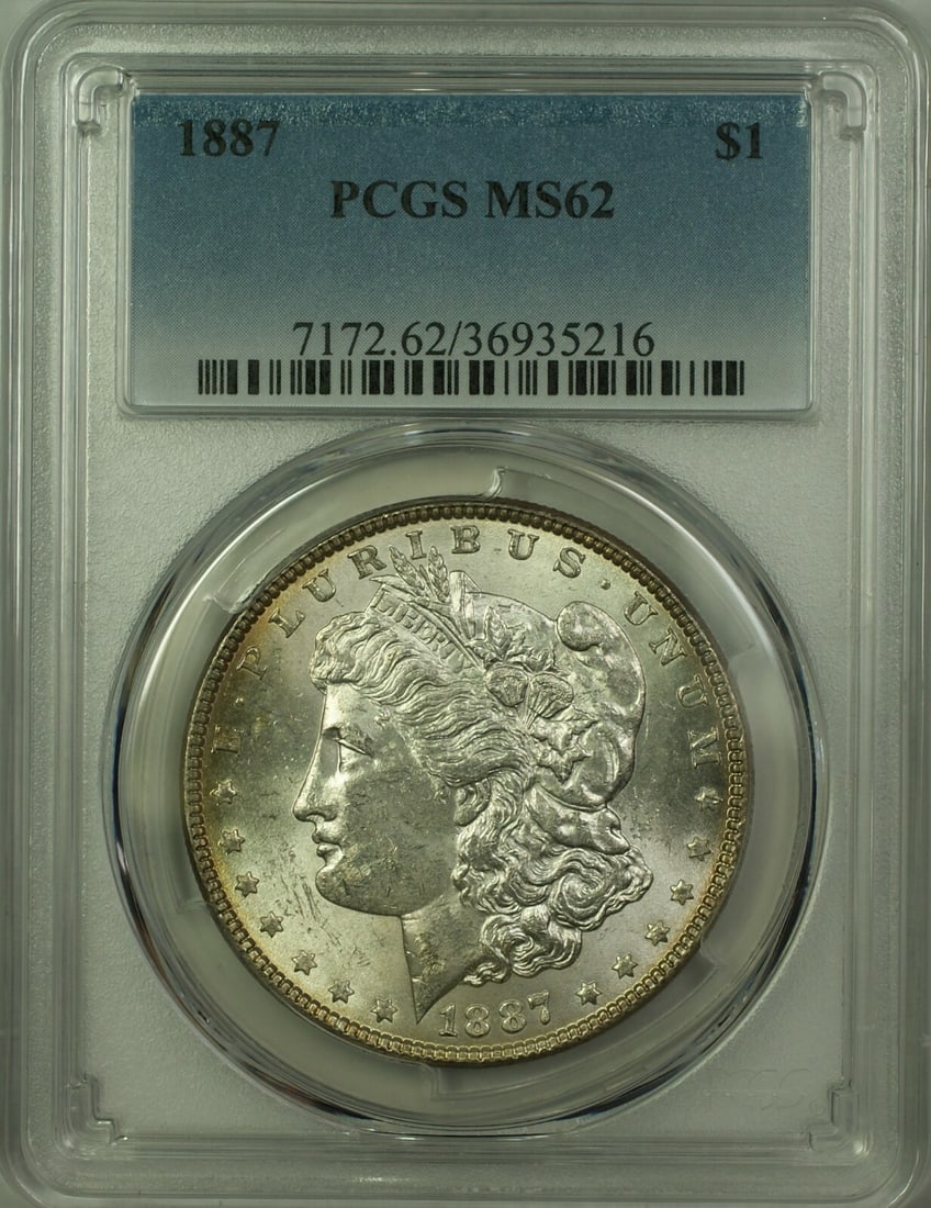 PCGS MS62 1887 Morgan Dollar Silver Coin Toned Reverse Philadelphia Mint: PCGS MS62 1887 Morgan Dollar Silver Coin Toned Reverse Philadelphia Mint This 1887 Morgan Silver Dollar features a $1 denomination and is composed of silver. Graded MS-62 by PCGS, the coin is uncircul