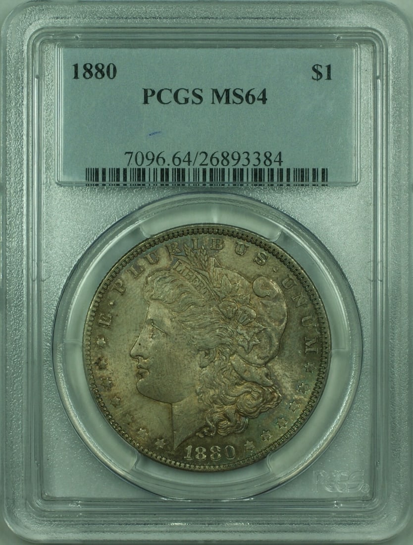 1880 Morgan Dollar PCGS MS64 Silver Coin With Deep Colorful Toning: 1880 Morgan Dollar PCGS MS64 Silver Coin With Deep Colorful Toning This 1880 Morgan Silver Dollar features richly colored dark toning and is certified by PCGS with a grade of MS 64. Minted in Philadel