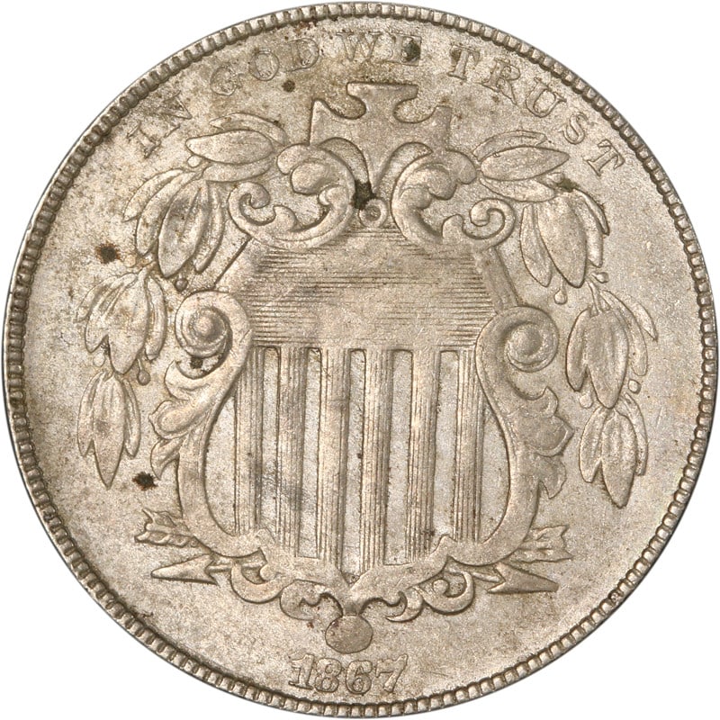 United States 1867 Nickel Shield Design Circulated Coin: United States 1867 Nickel Shield Design Circulated Coin This is an 1867 Shield Nickel from the United States. The coin is circulated and made of nickel. It is uncertified and offered in pre-owned cond