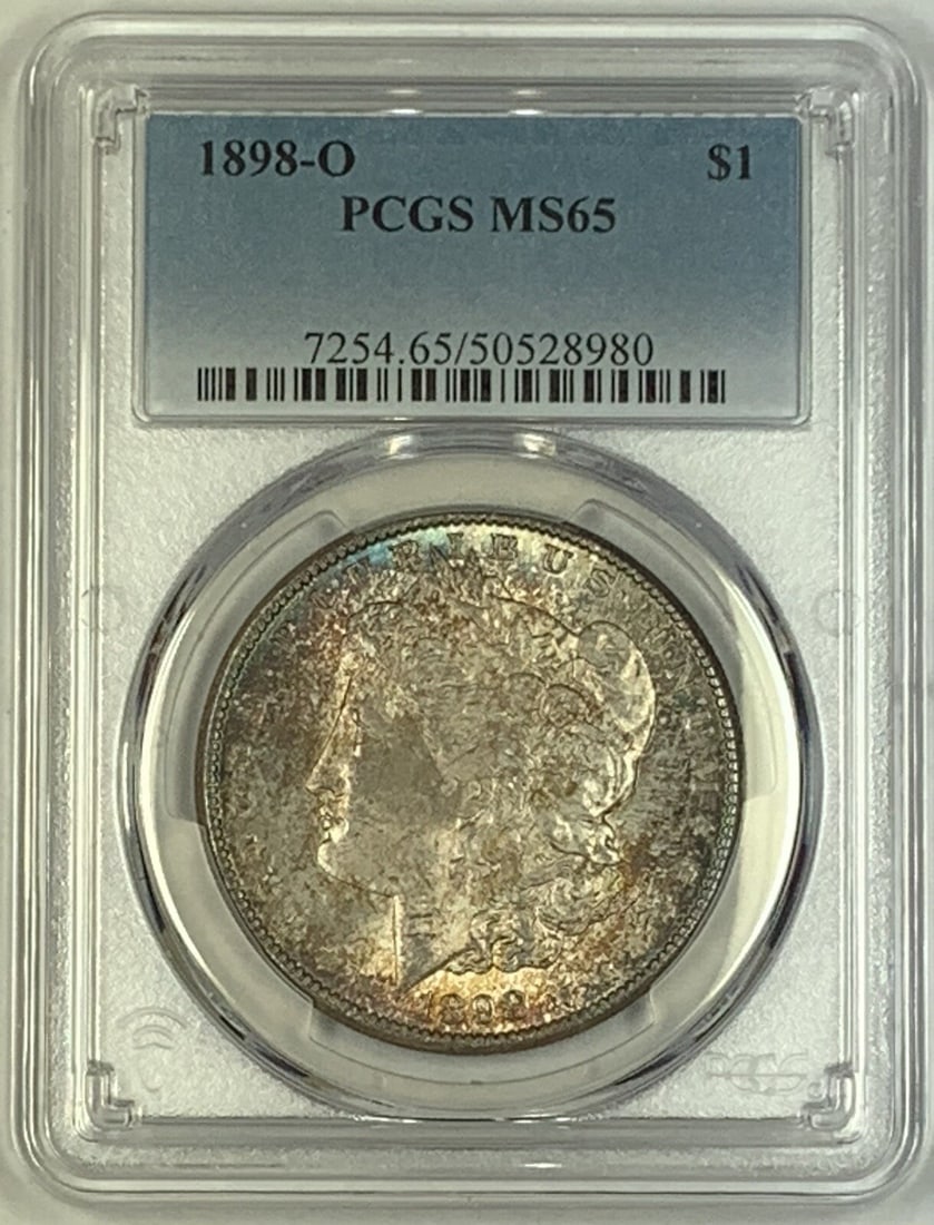 PCGS MS 65 1898-O Morgan Dollar Silver Coin Toned Uncirculated: PCGS MS 65 1898-O Morgan Dollar Silver Coin Toned Uncirculated This 1898-O Morgan Silver Dollar is a toned, uncirculated coin certified by PCGS with a grade of MS 65. It features the classic Morgan de