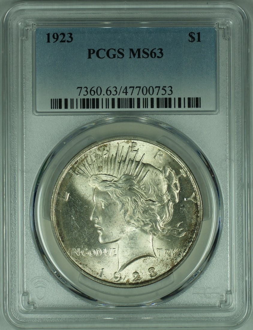 PCGS MS 63 Graded 1923 Silver Peace Dollar Coin: PCGS MS 63 Graded 1923 Silver Peace Dollar Coin This 1923 Peace Silver Dollar is certified by PCGS with a grade of MS 63. The coin is uncirculated and composed of silver, representing the United State