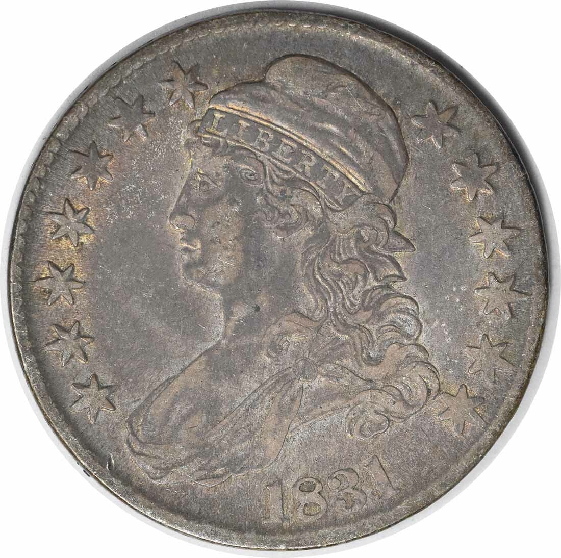 1831 Bust Half Dollar 50C John Reich Design Uncertified: 1831 Bust Half Dollar 50C John Reich Design Uncertified This 1831 Bust Half Dollar is a remarkable piece of numismatic history. Struck at the Philadelphia mint, this coin is part of the 50 cent denomi