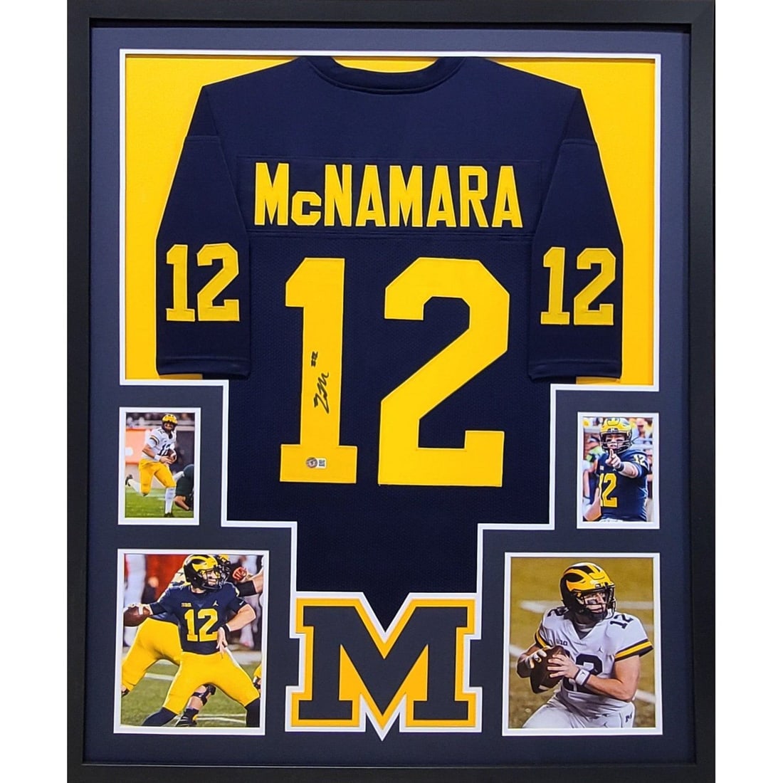 Framed Cade McNamara Michigan Jersey Beckett Authenticated Autograph: Framed Cade McNamara Michigan Jersey Beckett Authenticated Autograph This is a framed Michigan Wolverines jersey autographed by Cade McNamara. The jersey has been authenticated by Beckett and features